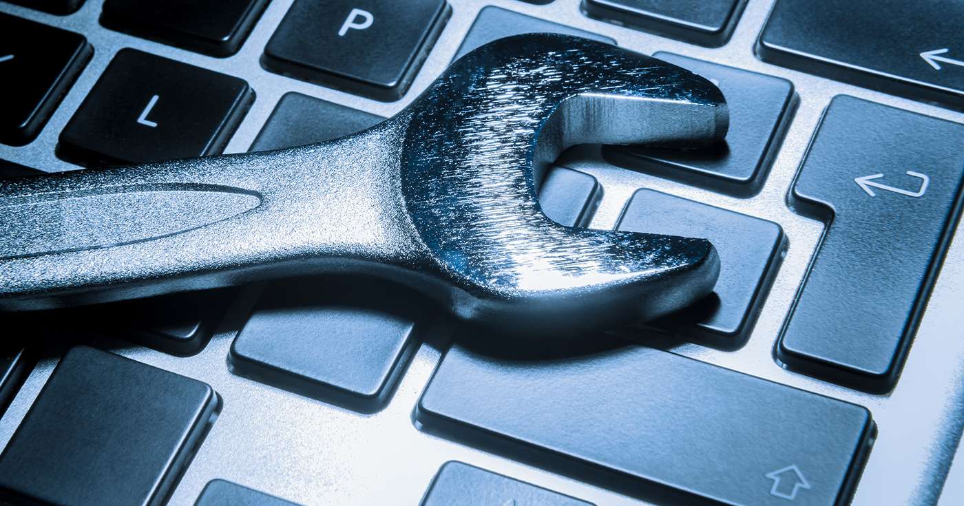 Computer / IT Support - Keyboard with a wrench